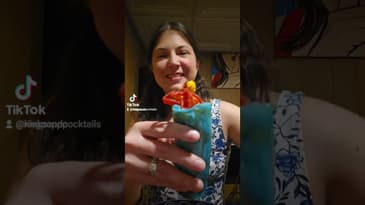 Kinks and Cocktails host Katie eats a pickle