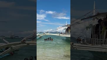 These kids having fun hunting for coins from tourists! #iloilo #shorts #philippines #ilocostrip