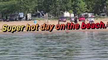 Glass water on Lake Huron hot day on the beach. 