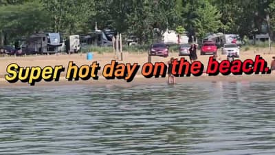 Glass water on Lake Huron hot day on the beach. 