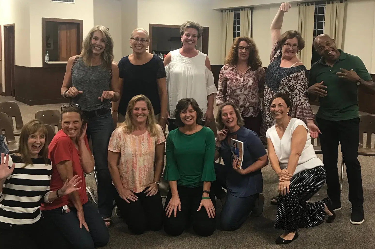 Lori Ann King, surrounded by the audience at an author event