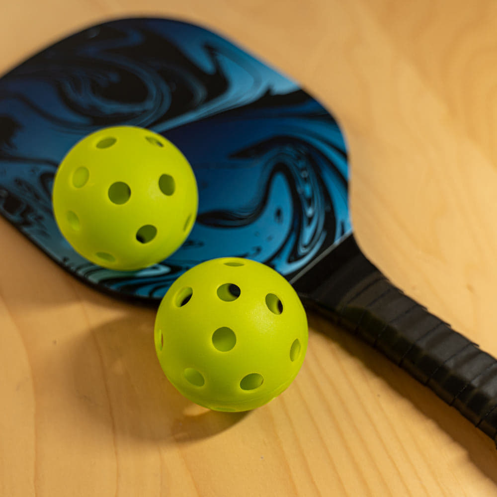 Sports bag with pickleball paddles and balls