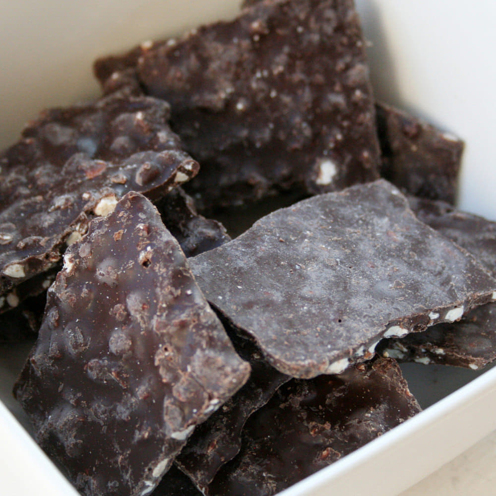 Dark chocolate bark topped with pumpkin seeds