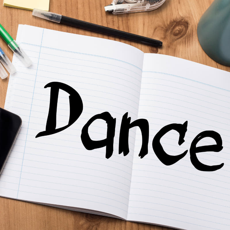 Notebook labeled Dance, representing planning a fun at-home dance workout without equipment.