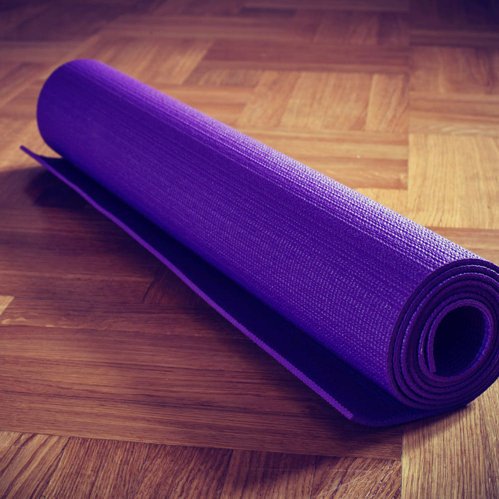 Purple yoga mat for stretching, yoga, or home exercise