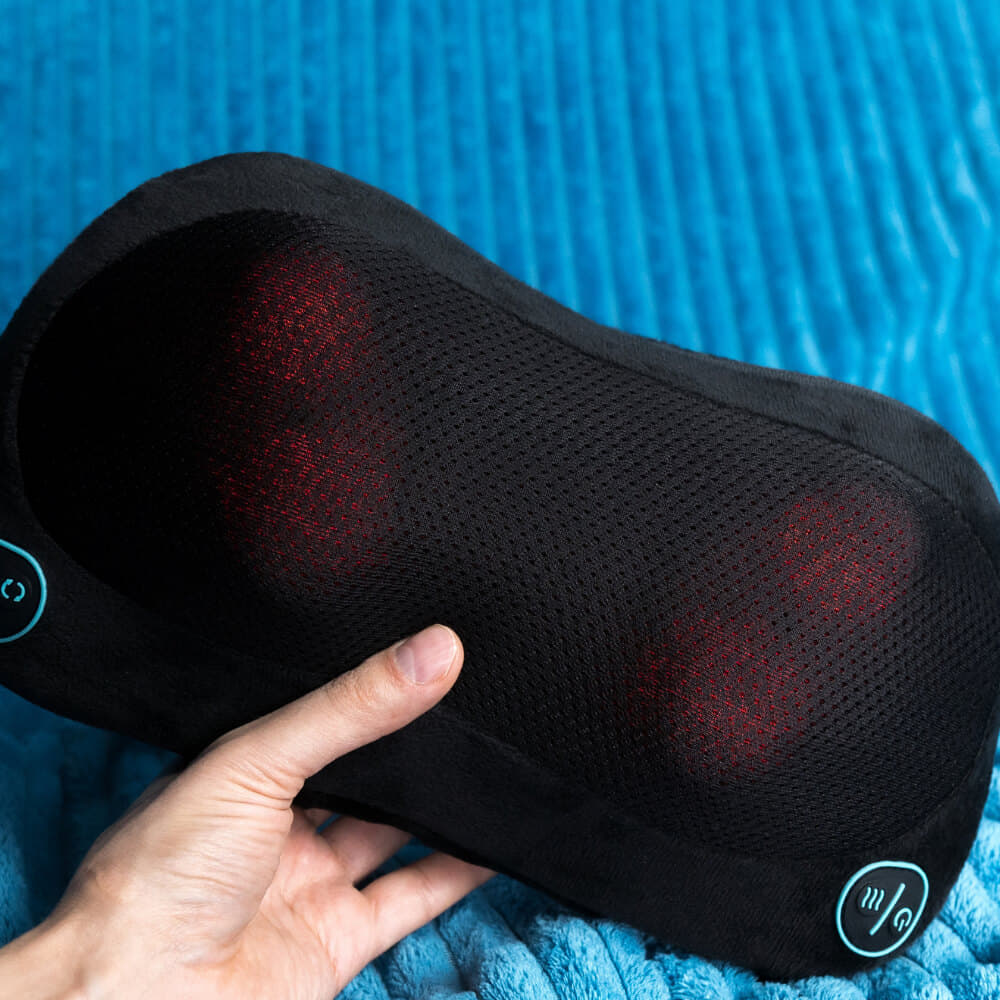 Black neck massager on blue blanket.  Meaningful gift for dad to relieve tension and promote relaxation.