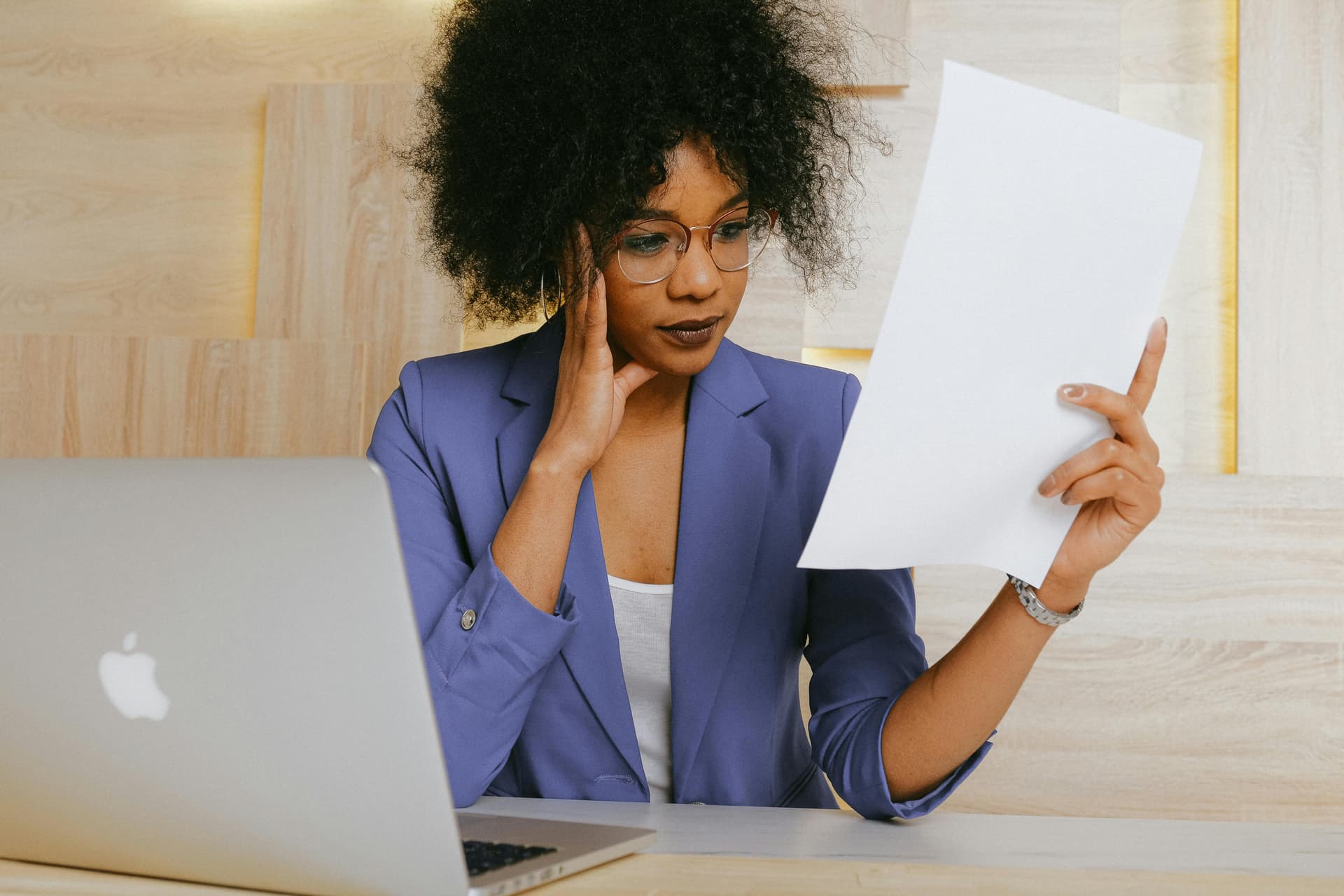 Female studying a document about clinical trials