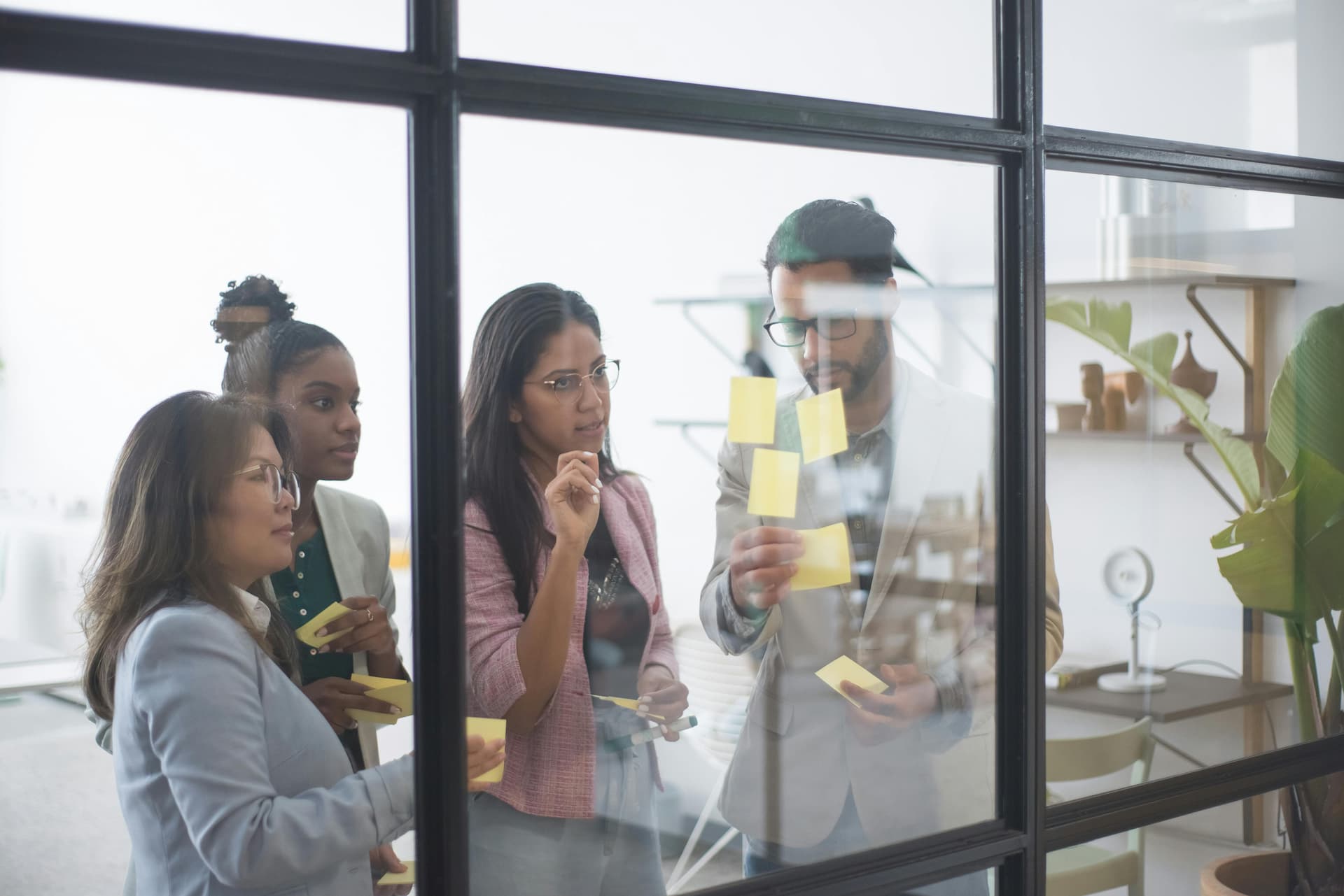 women and one man discussing women's health in the workplace