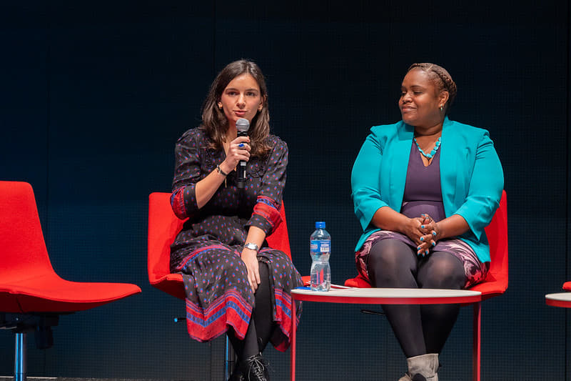 Co-Founder Elise Mekkaoui talking on stage about her AI FemTech solution