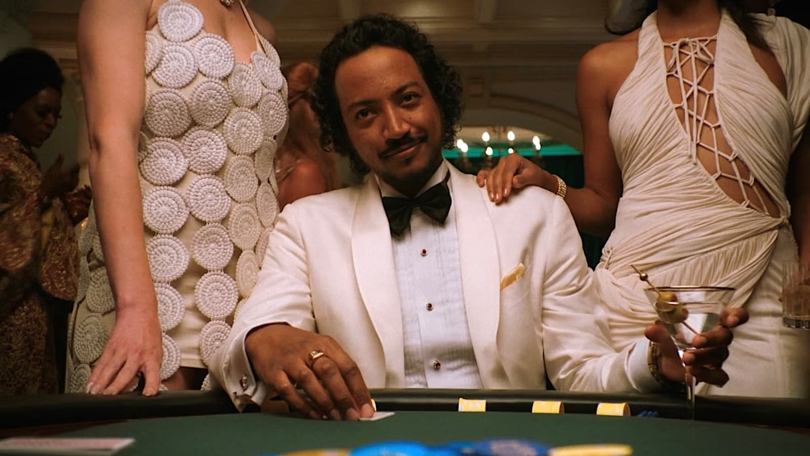 Koumba Diabaté, played by Samba Schutte, plays poker in episode 6 of Pluribus on Apple TV