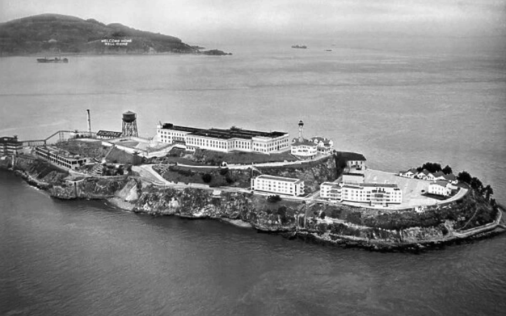 Aerial view of Alcatraz Island surrounded by water, emphasizing its remote and secure location.